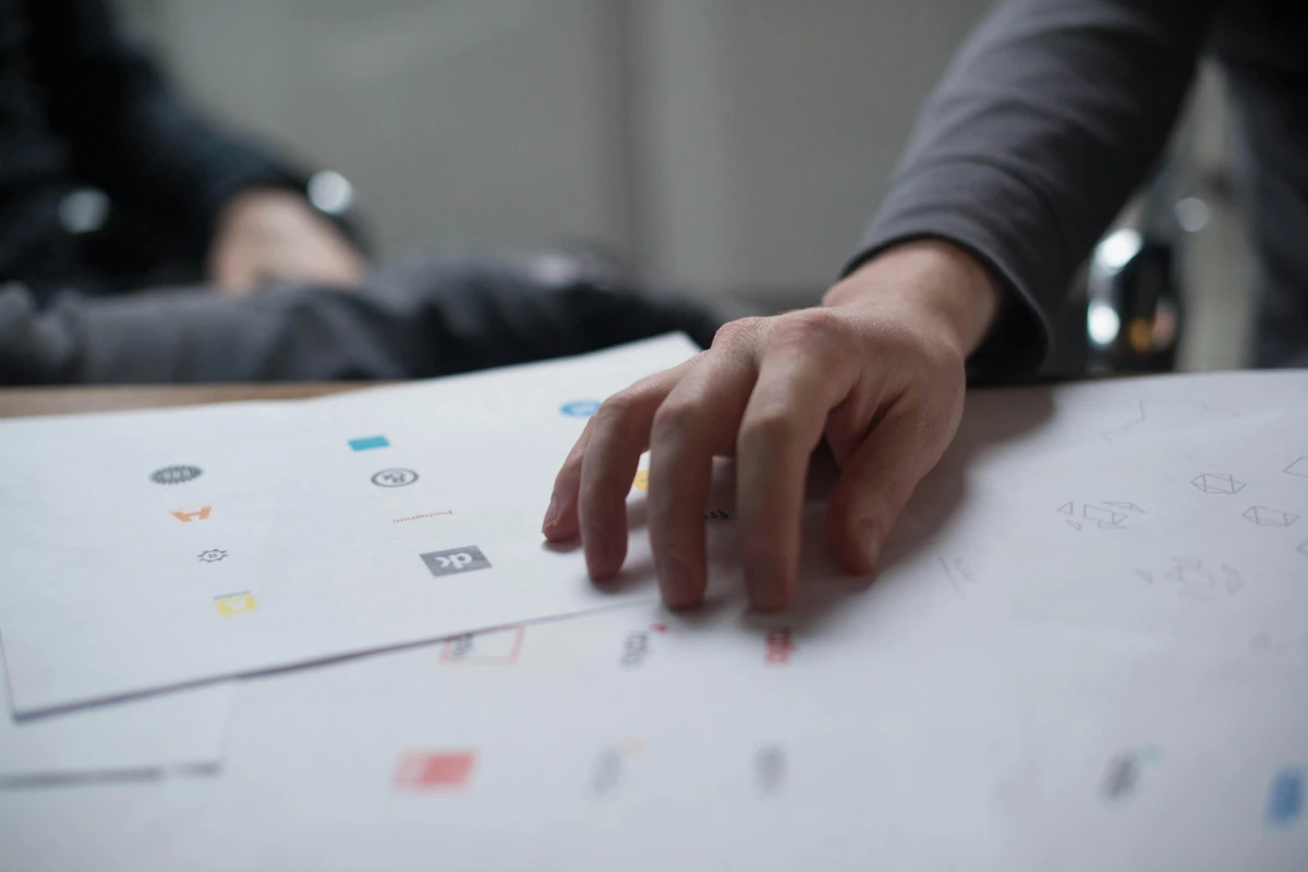 a photo of people review logo design concepts